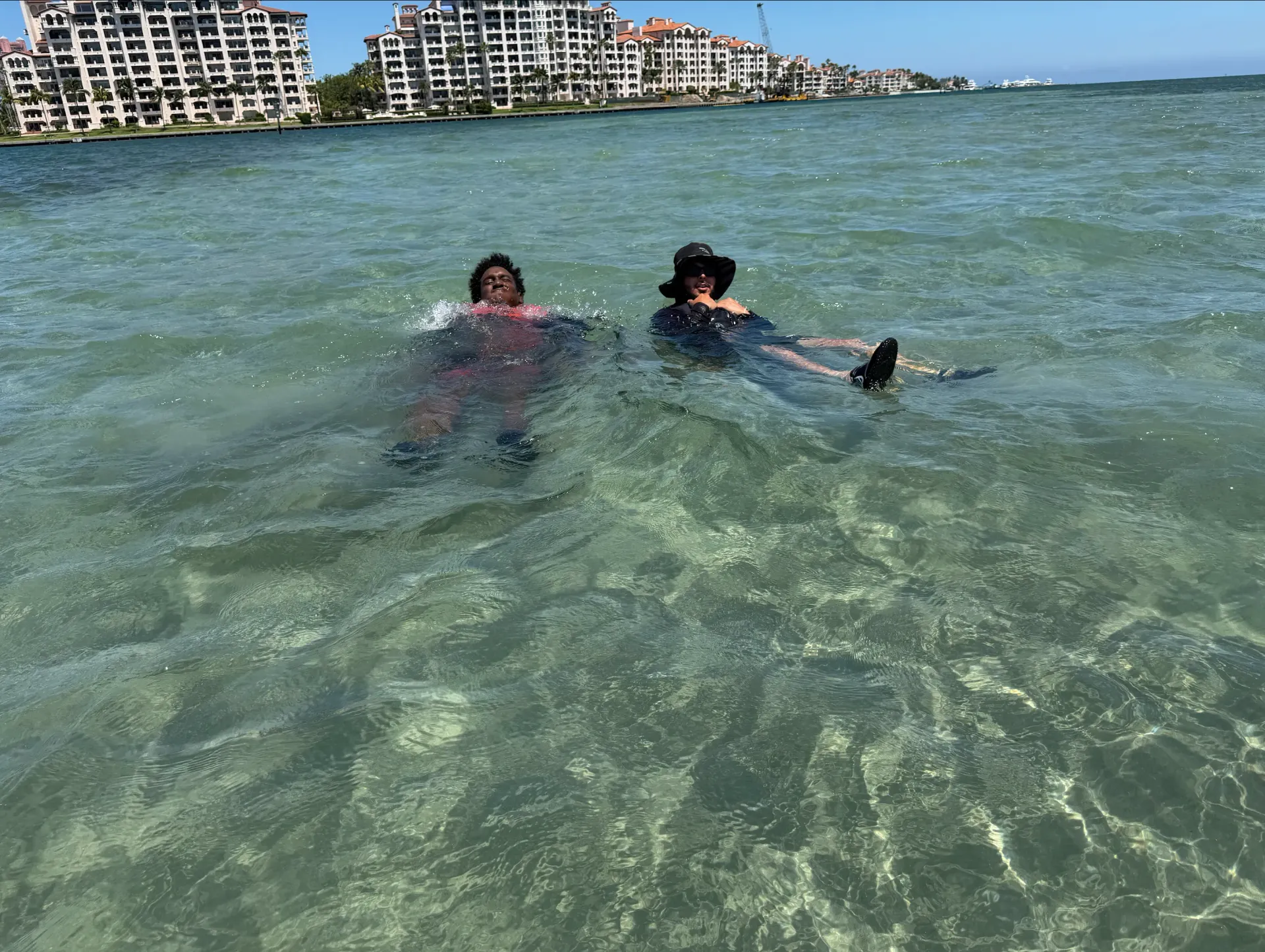 Guests relaxing at the Fisher Island sandbar during a Miami Jet Ski Tour