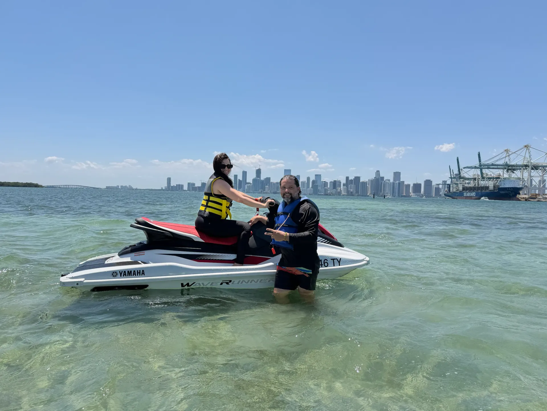 Guide assisting a guest during a guided Miami Jet Ski Tour on Biscayne Bay