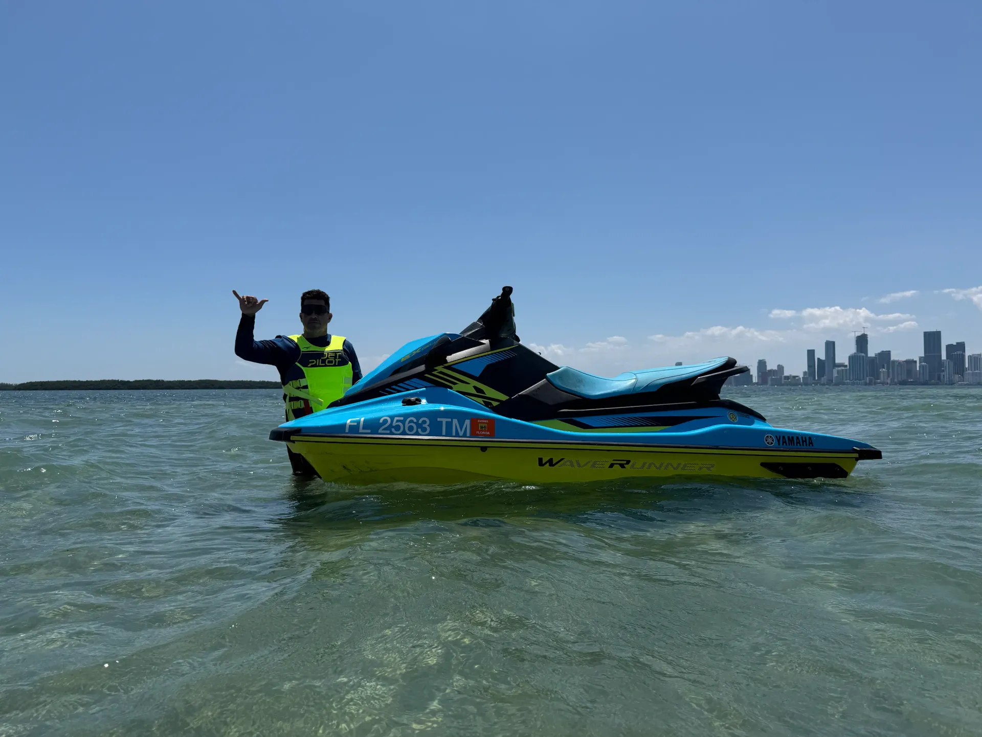 Guide leading Miami Jet Ski Tours across Biscayne Bay with Miami skyline views
