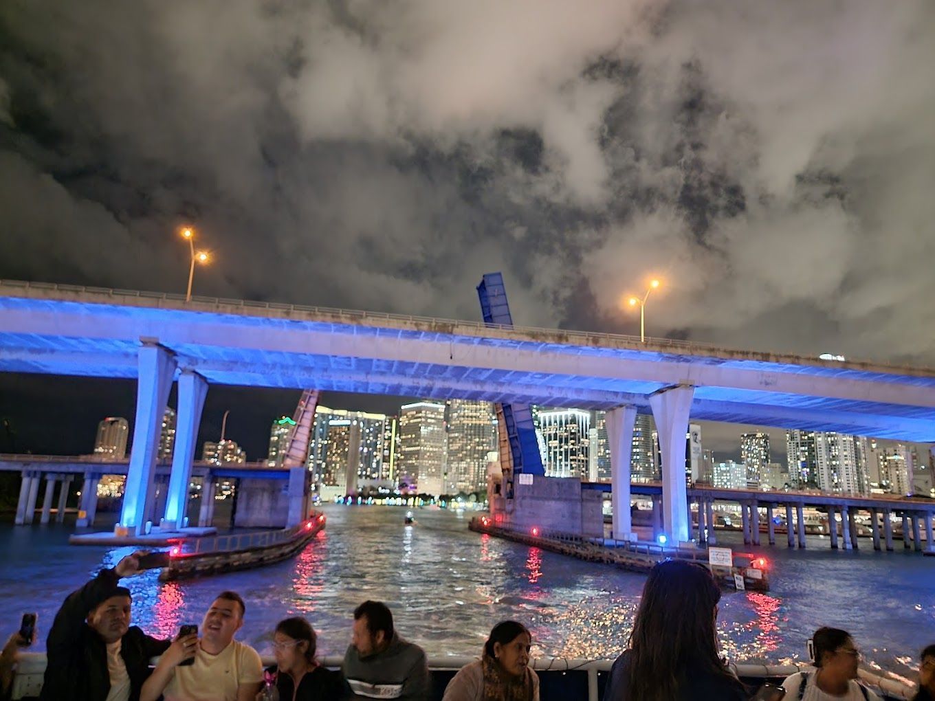Miami Night Boat Tours departing from Bayside with passengers in the front of the boat tour