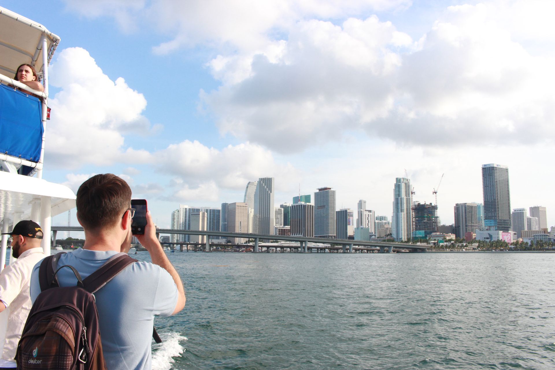 Passenger on the Miami Boat Tour taking photos of the Miami Skyline