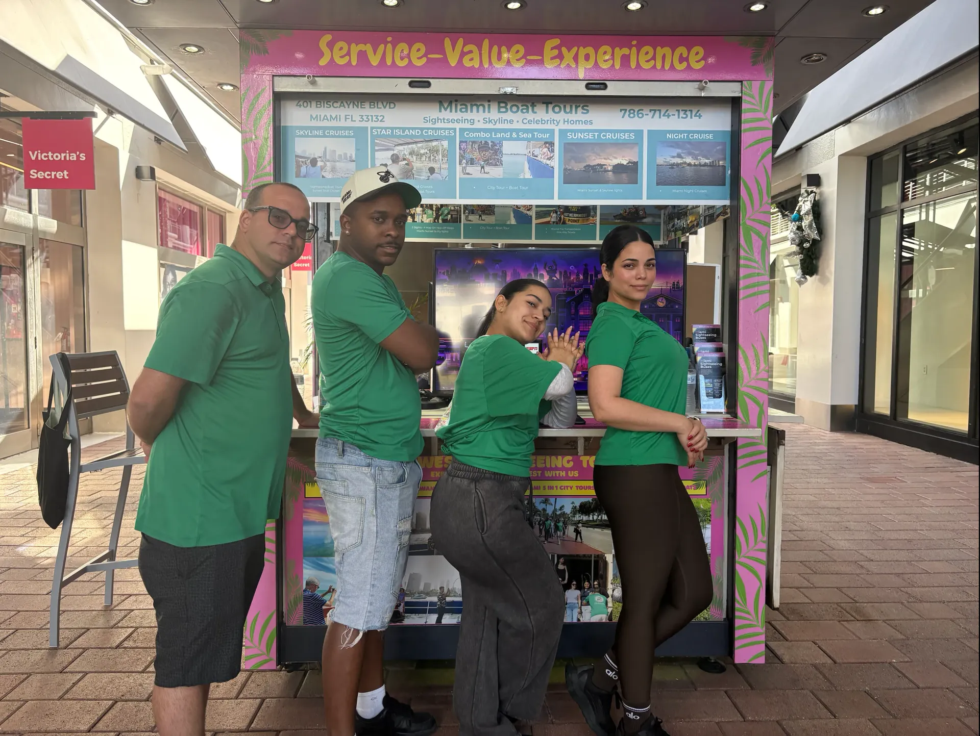 Miami Boat Tours team at official Bayside Marketplace kiosk assisting guests before boat tour