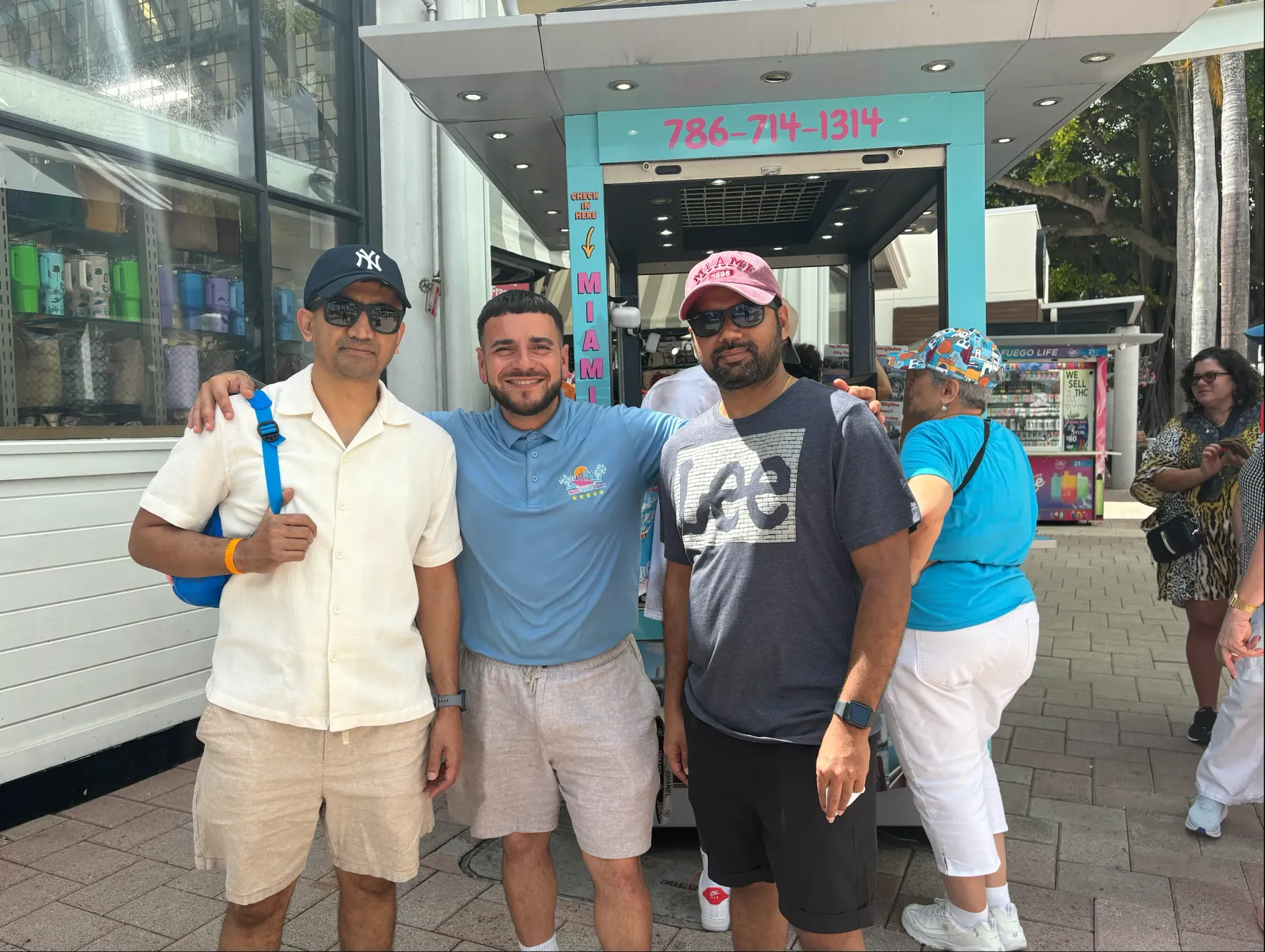 Guests with Miami Boat Tours staff at check-in location in Bayside Marketplace before boat tour