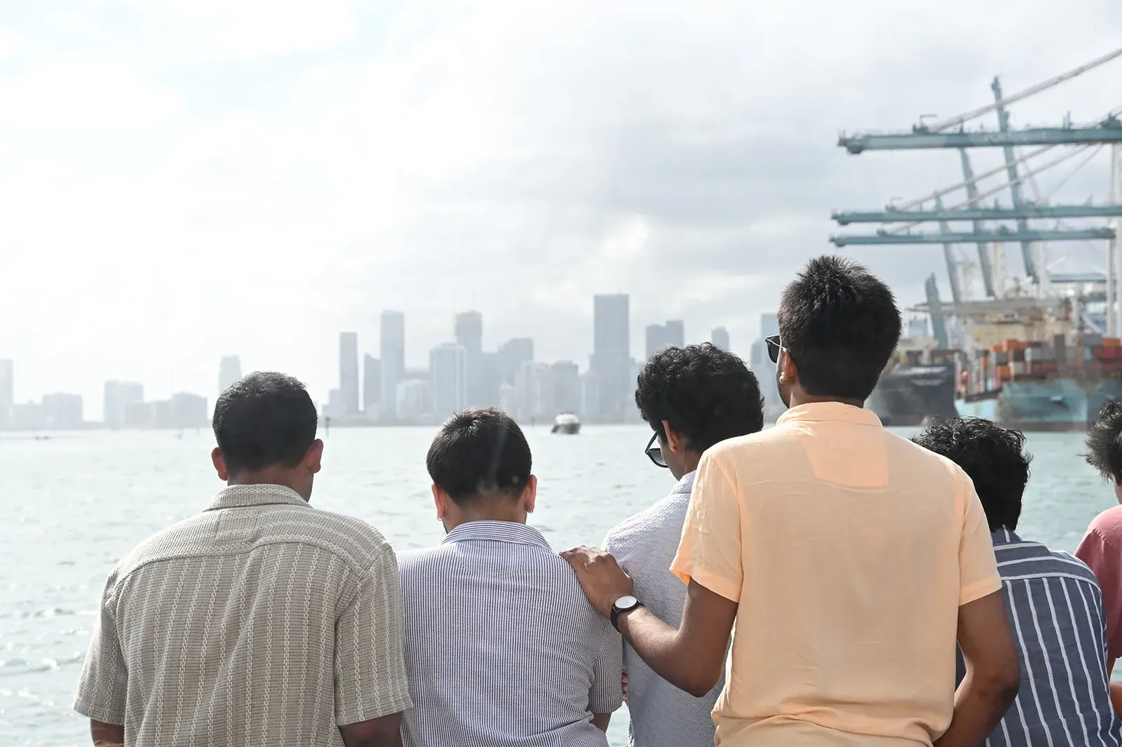 group enjoying Miami boat tours with skyline views and Port of Miami during Biscayne Bay cruise