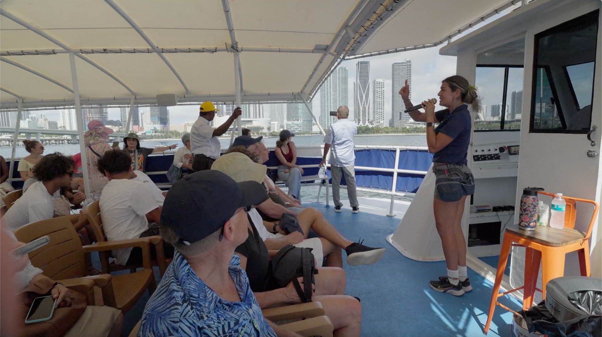 Tour guide on a Miami Friendly Boat Cruise with views of the Miami Skyline