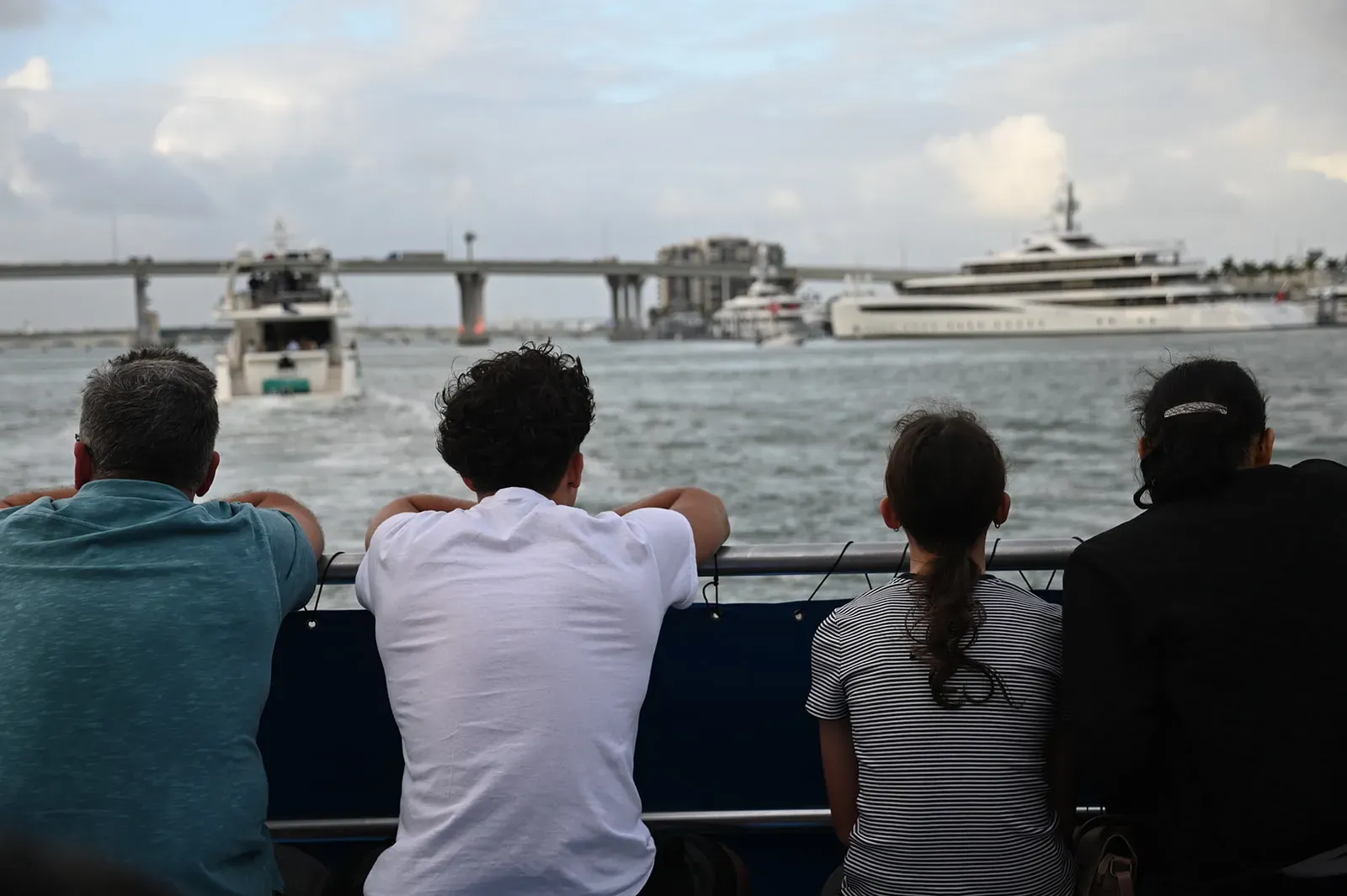 guests enjoying a Miami sightseeing cruise on Biscayne Bay with yachts and passing boats