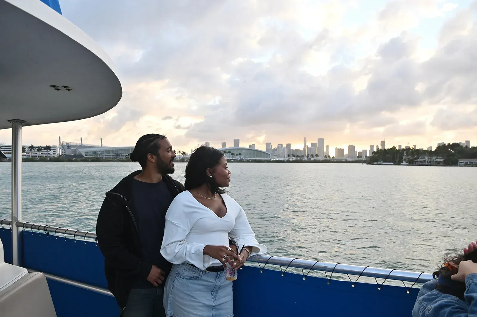 Miami sightseeing from the water with visitors enjoying the Downtown Miami skyline during a sunset cruise on Biscayne Bay