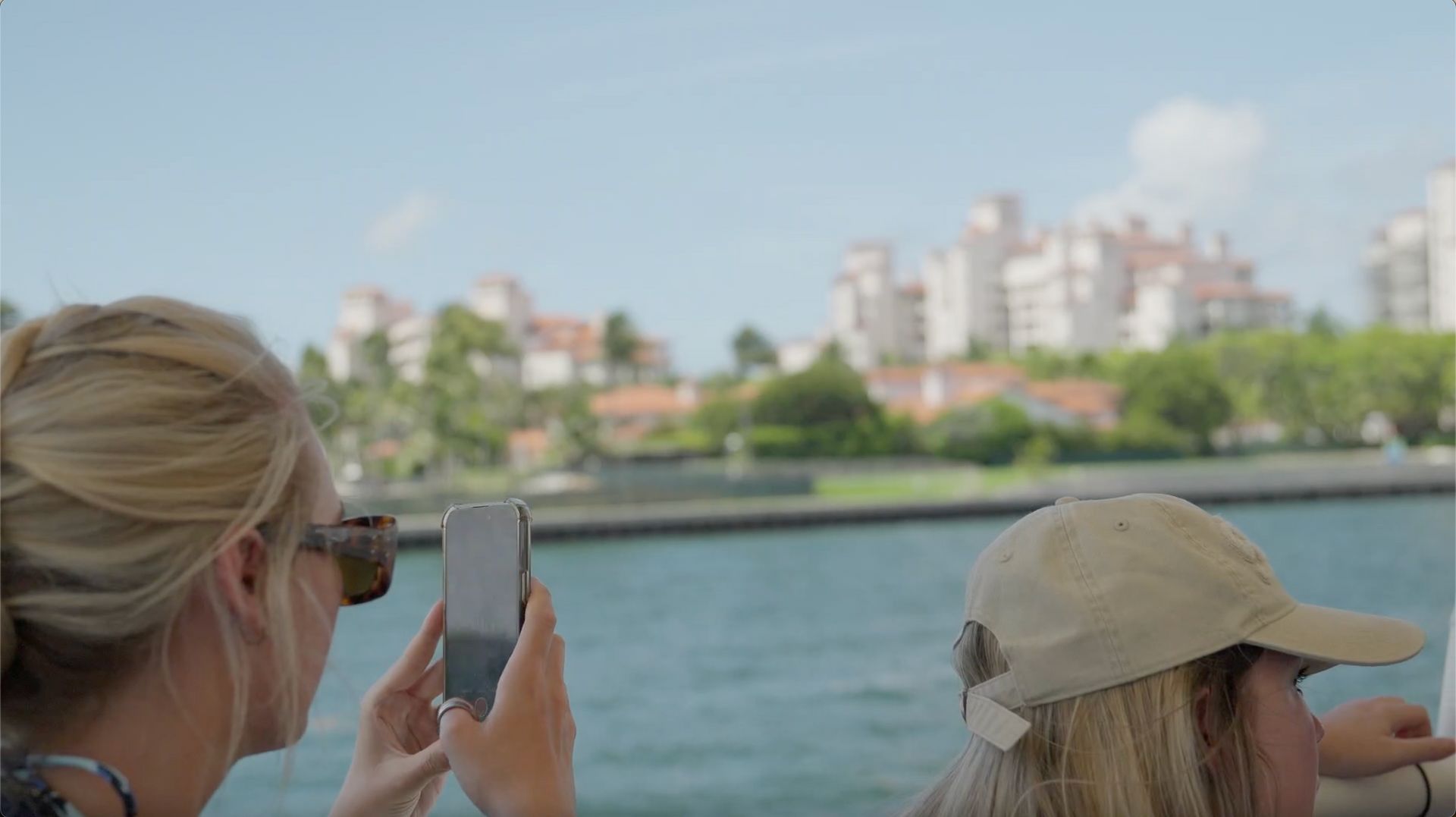 Miami Sightseeing Winter Boat Tour Passengers taking photos of Fisher Island
