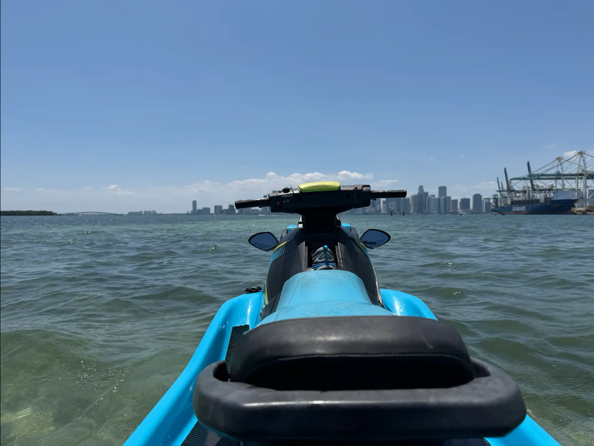 Jet ski floating on Biscayne Bay with panoramic views of the Miami skyline in the distance