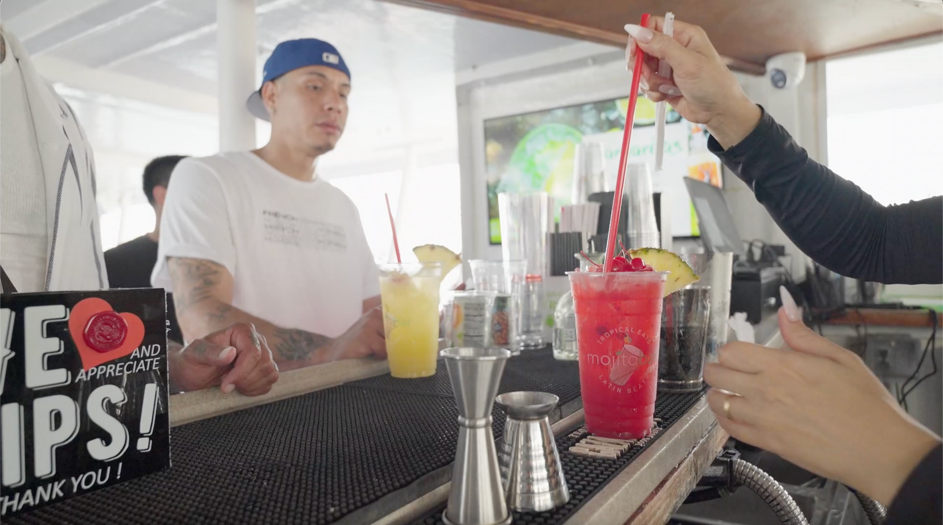passenger getting drinks from the Mojito Bar onboard