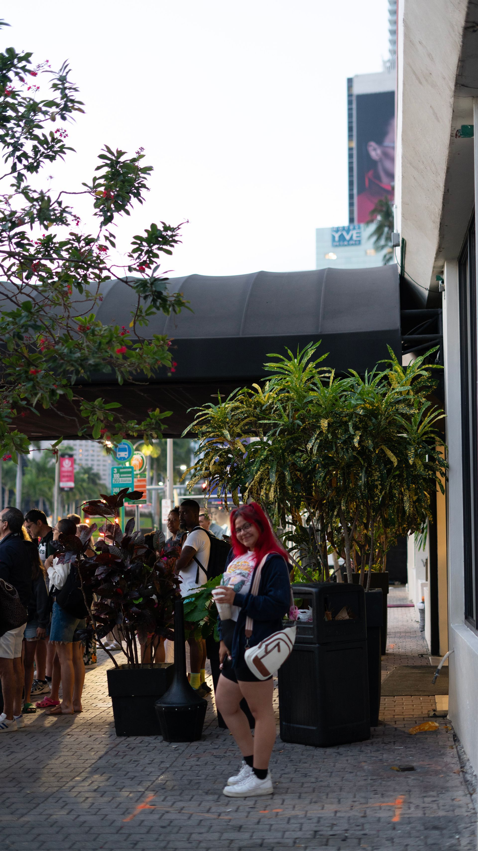 Tourist waiting at the Miami pickup area for the Key West bus tour