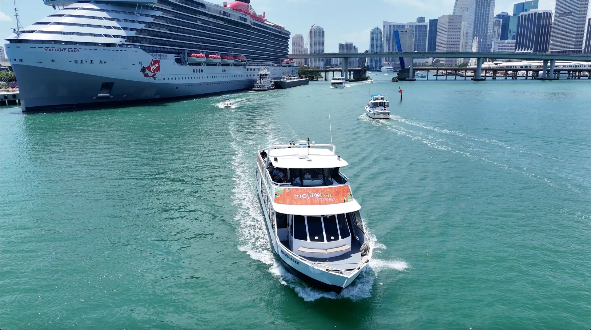 Miami sightseeing boat cruising past PortMiami with the Downtown Miami skyline before and after a Miami cruise.