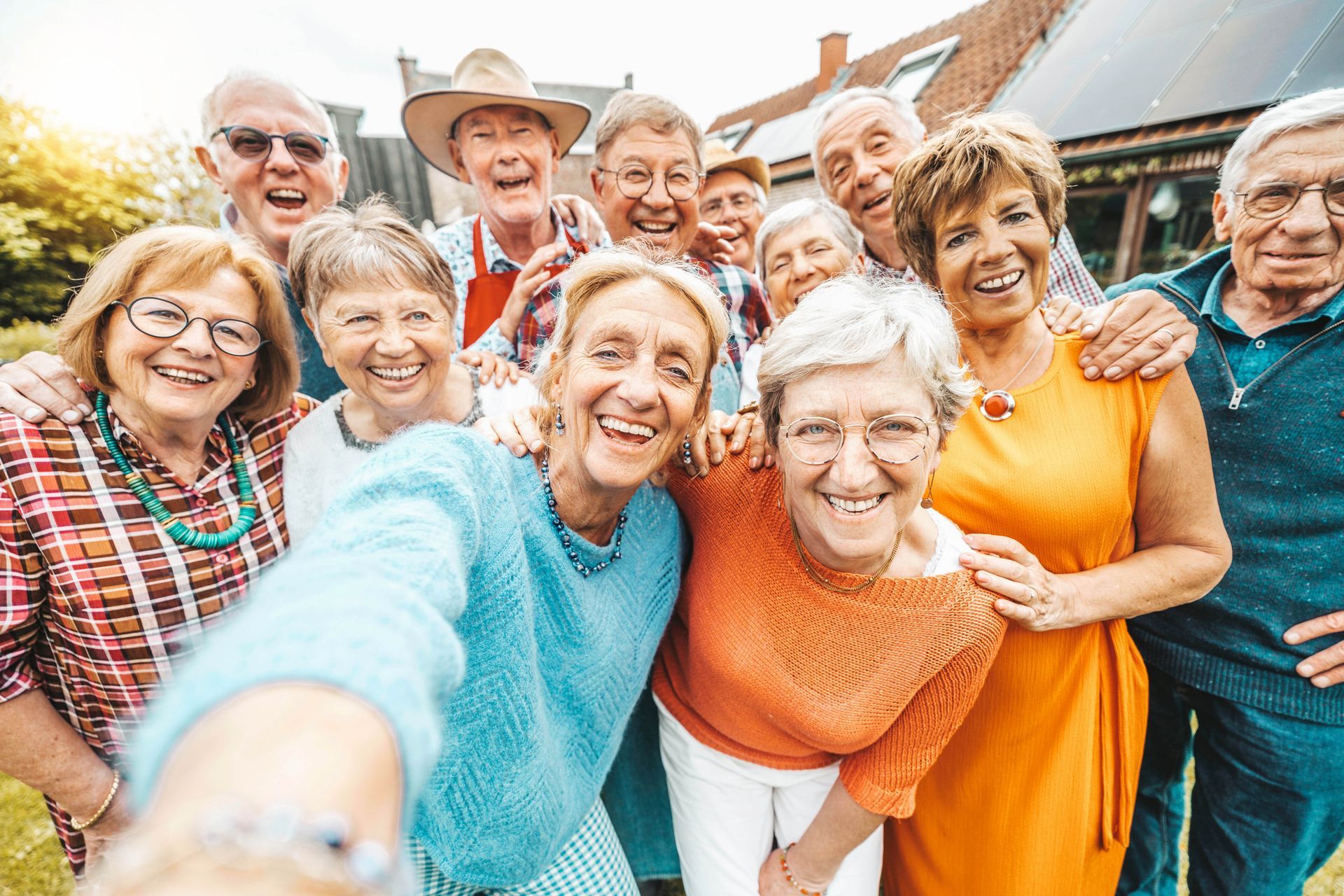 A group of elderly people are taking a selfie together.
