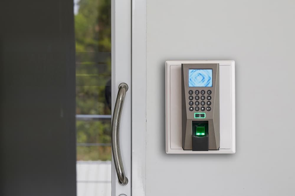A Fingerprint Scanner is Mounted on a Wall Next to a Door — Coast & Hinterland Mobile Locksmiths In Noosaville, QLD