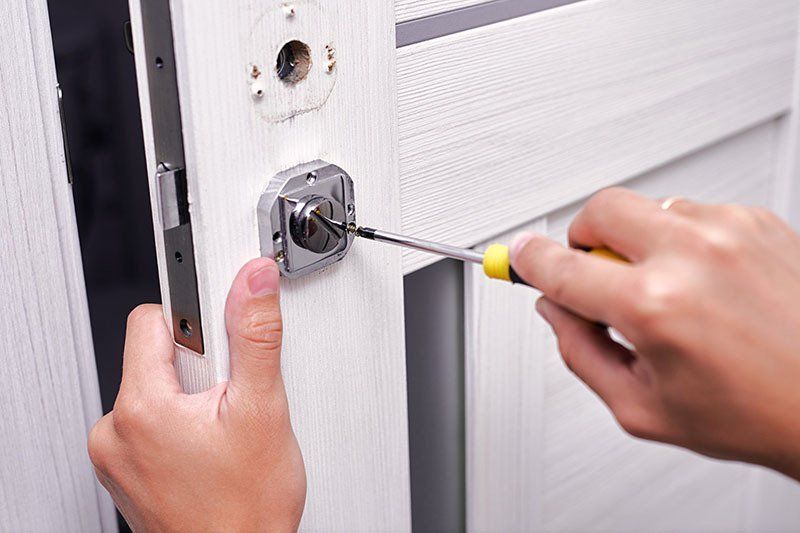 Fixing a Door Lock — Coast & Hinterland Mobile Locksmiths In Noosaville, QLD