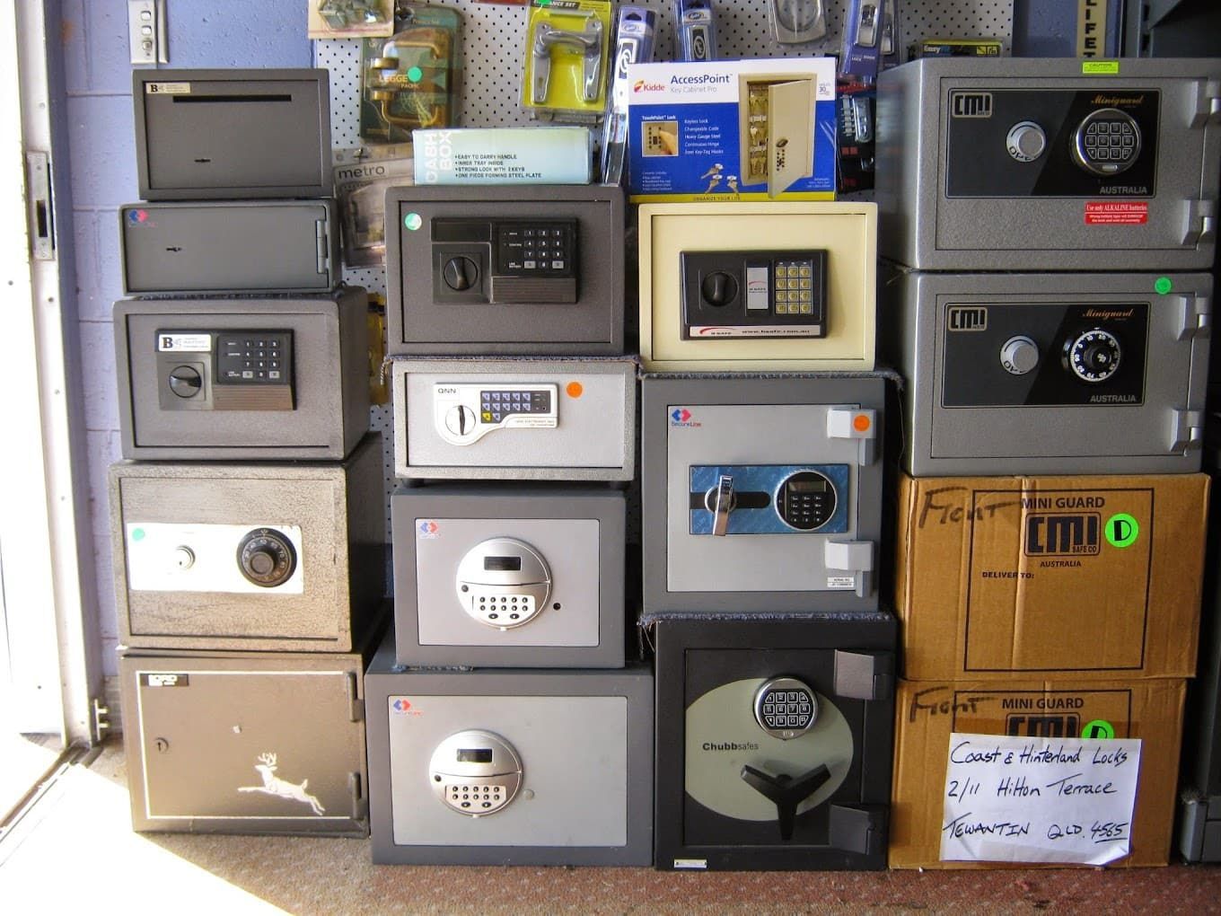 A Bunch of Safes Are Stacked on Top of Each Other — Coast & Hinterland Mobile Locksmiths In Noosaville, QLD