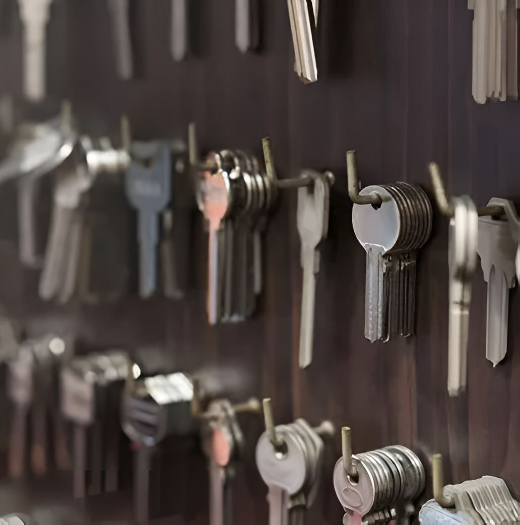 A Bunch of Keys Are Hanging on a Wall — Coast & Hinterland Mobile Locksmiths In Noosaville, QLD