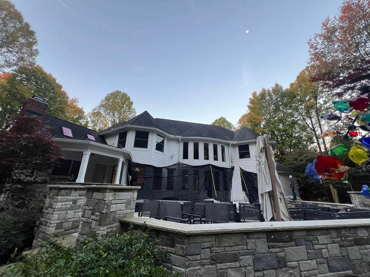 Wide house with retaining walls in backyard