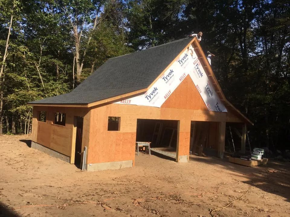 A house that is being built with styrofoam on the roof