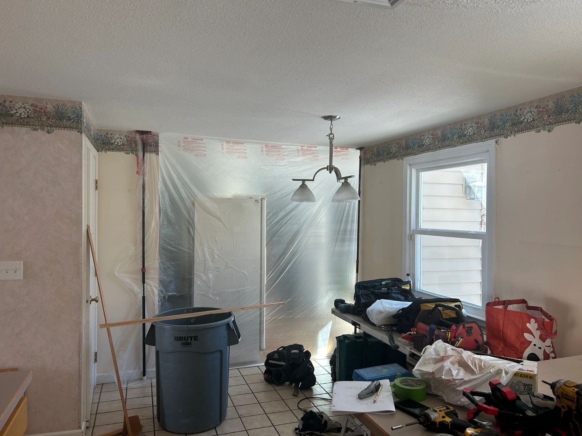 A room with a trash can in the middle of it