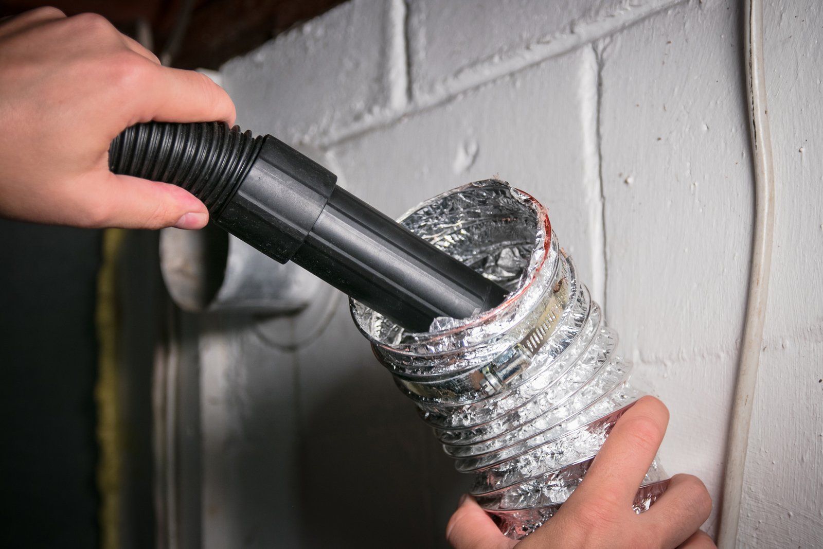 Vacuum Cleaning A Flexible Aluminum Dryer Vent — Midland, TX — All American Appliance Service