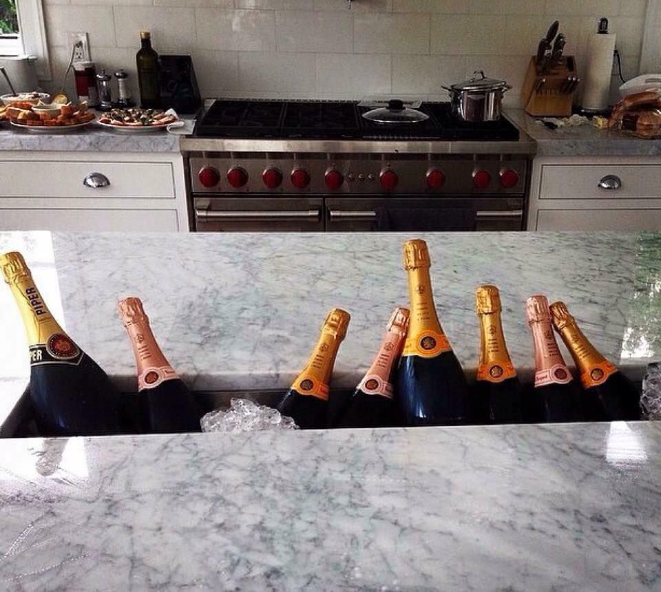 Bottles Of Champagne In The Kitchen Countertop — Kitchen Builders in Goonellabah, NSW
