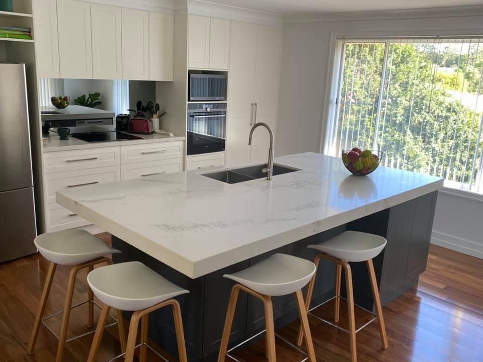 Kitchen With Large Island And Stool Bar Chairs — Kitchen Cabinets in Northern Rivers, NSW