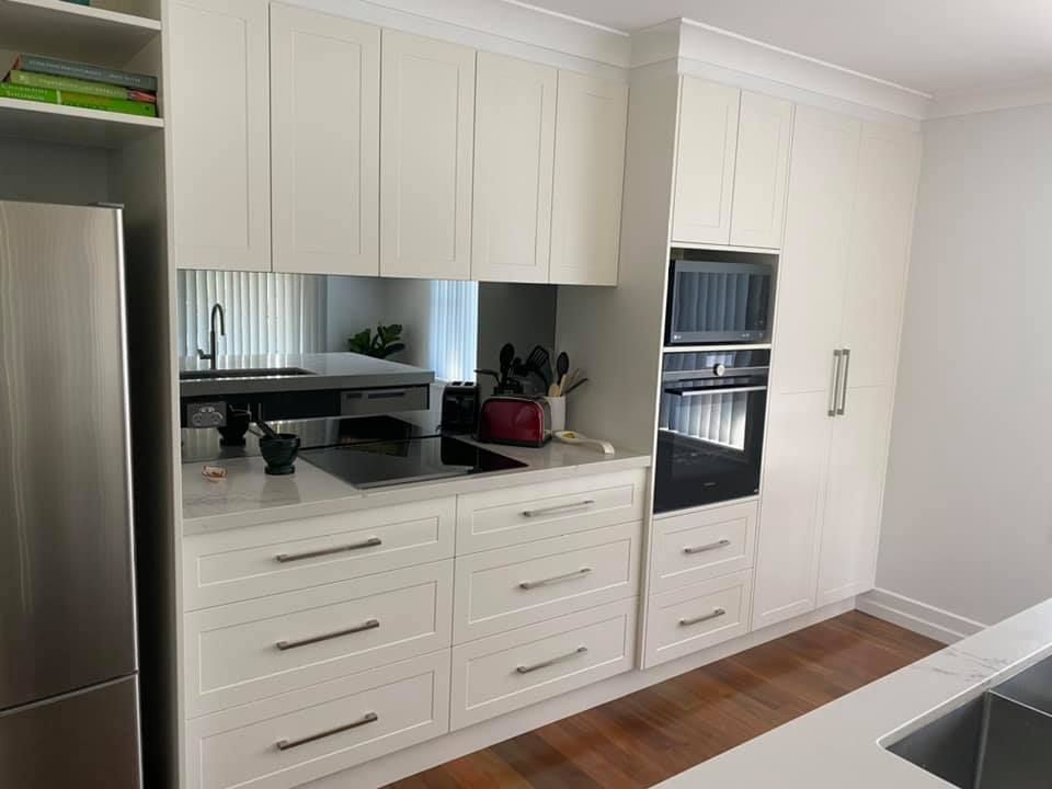 Kitchen With White Cabinets And Appliances — Kitchen Cabinets in Northern Rivers, NSW