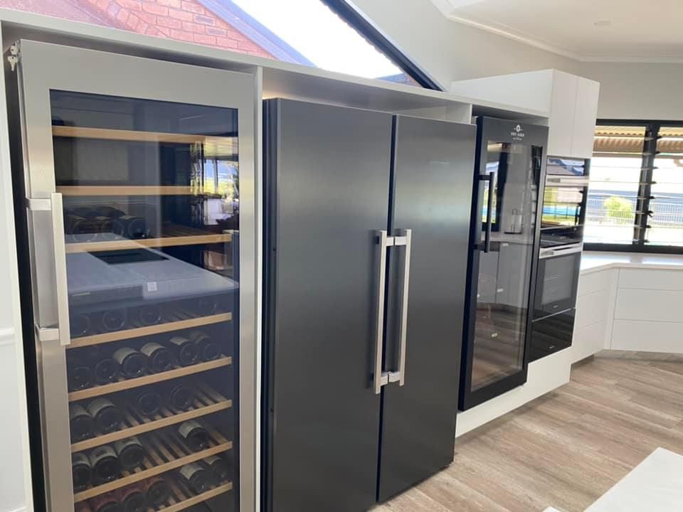 Black Refrigerator And Wine Fridge In The Kitchen — Kitchen Cabinets in Lismore, NSW