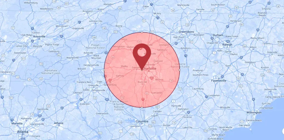 A map with a red pin in the middle of it.