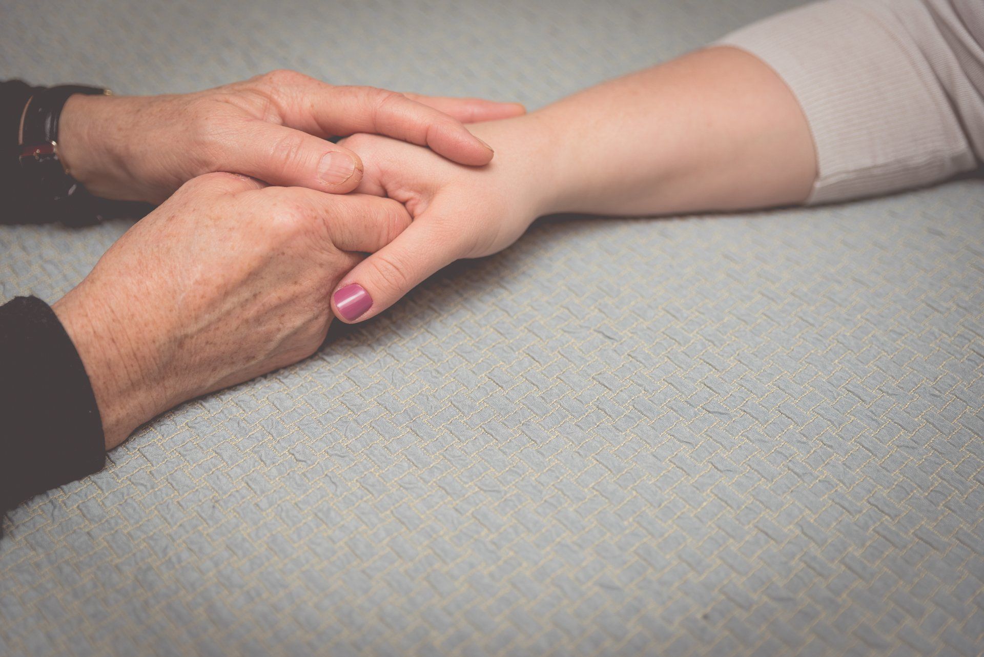 two people holding hands