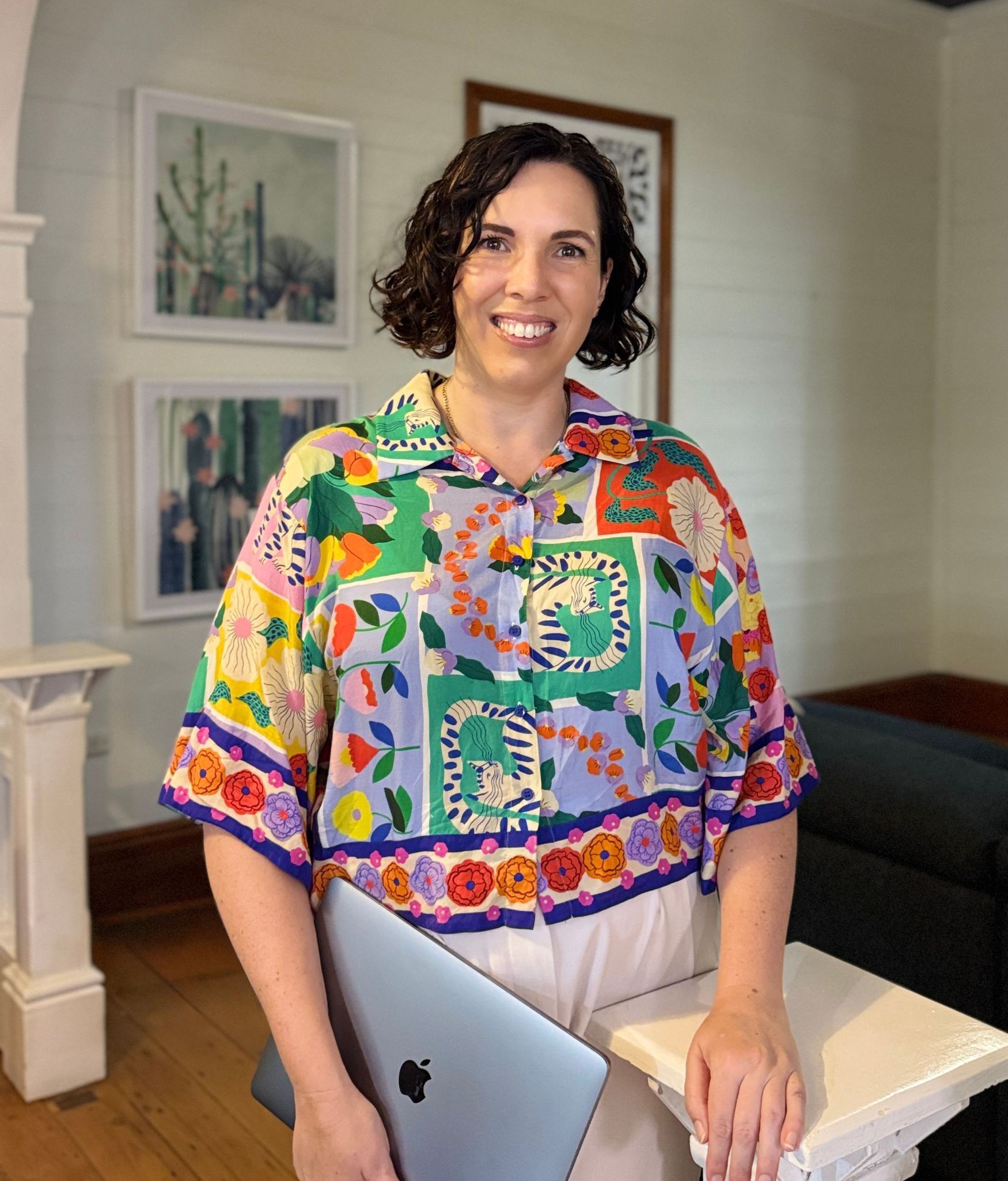 sarah dummer smiling in colourful shirt