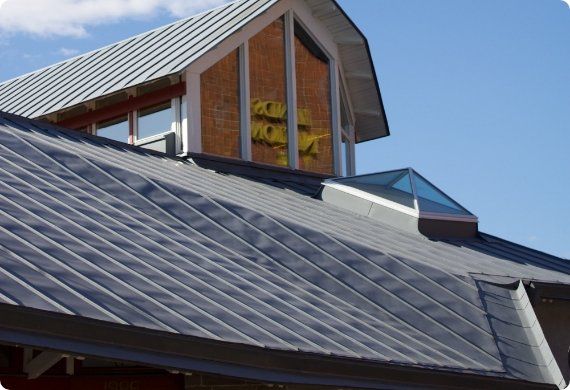 A roof of a building with a skylight on top of it