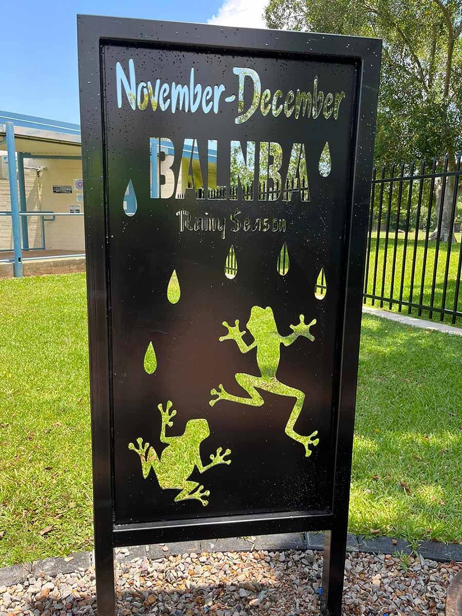 A Black Sign with A Frog and Rain Drops on It — Green Vision NT in Lee Point, NT