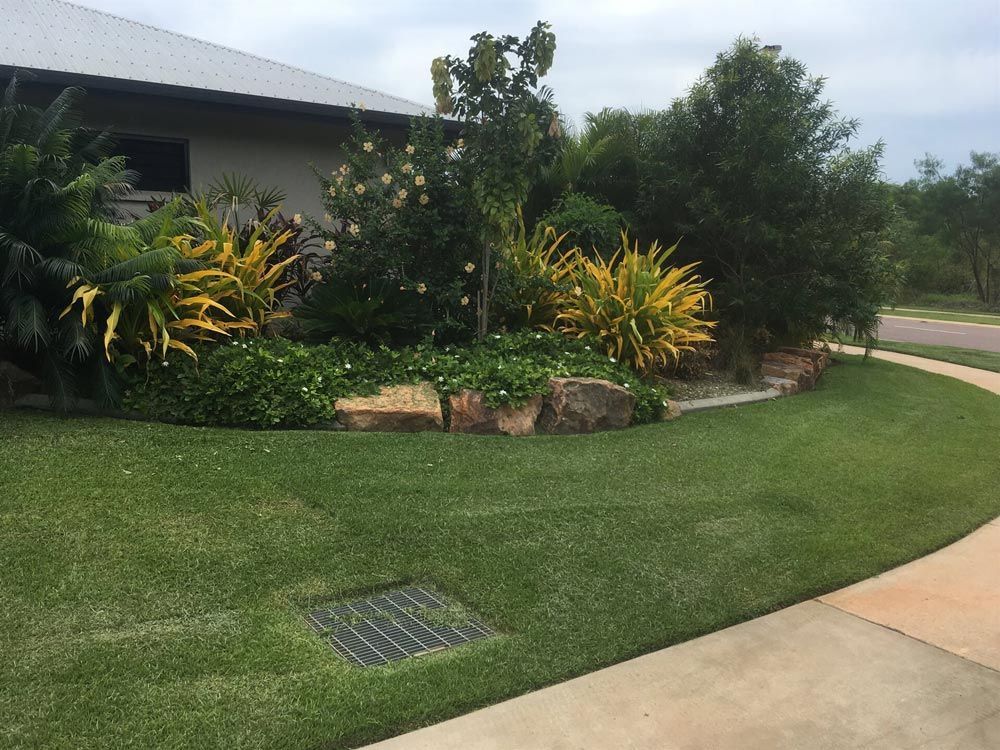 A House with A Lush Green Lawn and A Walkway in Front of It — Green Vision NT in Virginia, NT