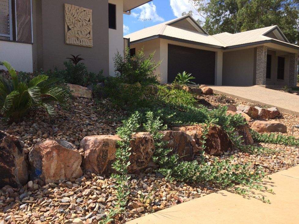 A House with A Lot of Rocks and Plants in Front of It — Green Vision NT in Virginia, NT