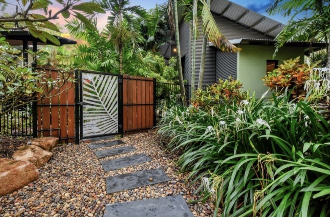 A Path Leading to A House with A Wooden Gate Surrounded by Plants — Green Vision NT in Virginia, NT