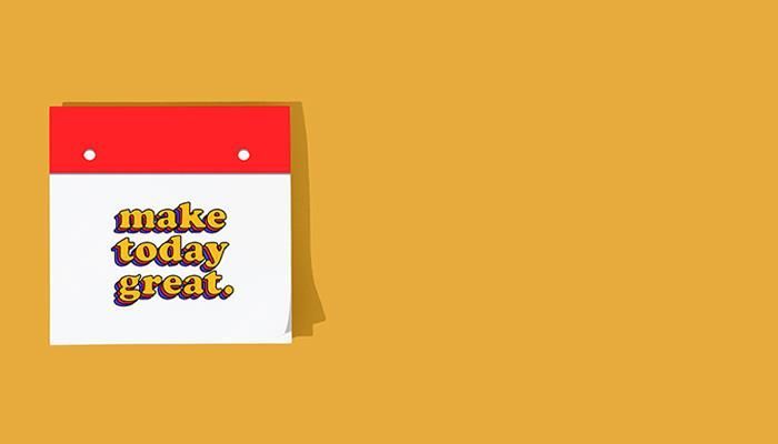 A calendar with a red top and 