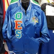 Blue satin varsity jacket with colorful embroidered letters and a star patch on the chest