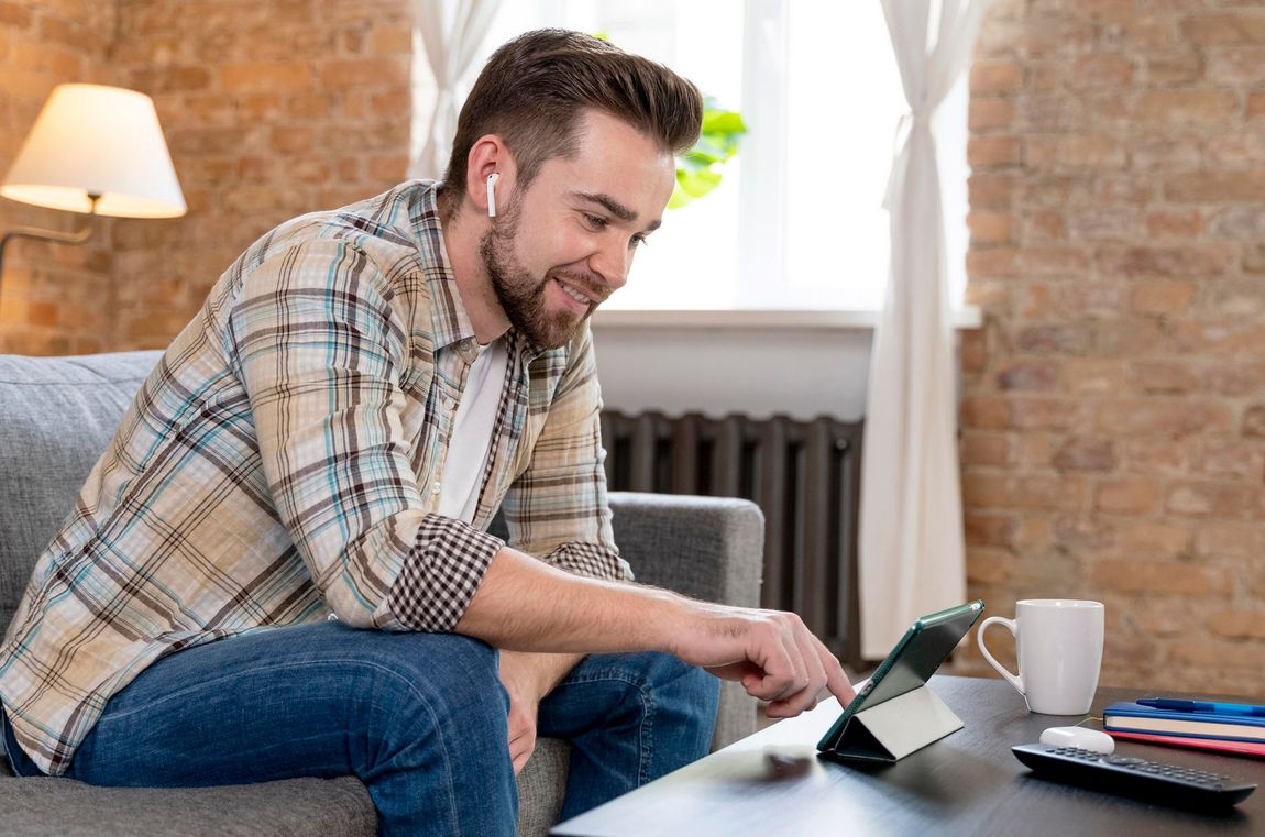 A person is typing on a telephone with their finger