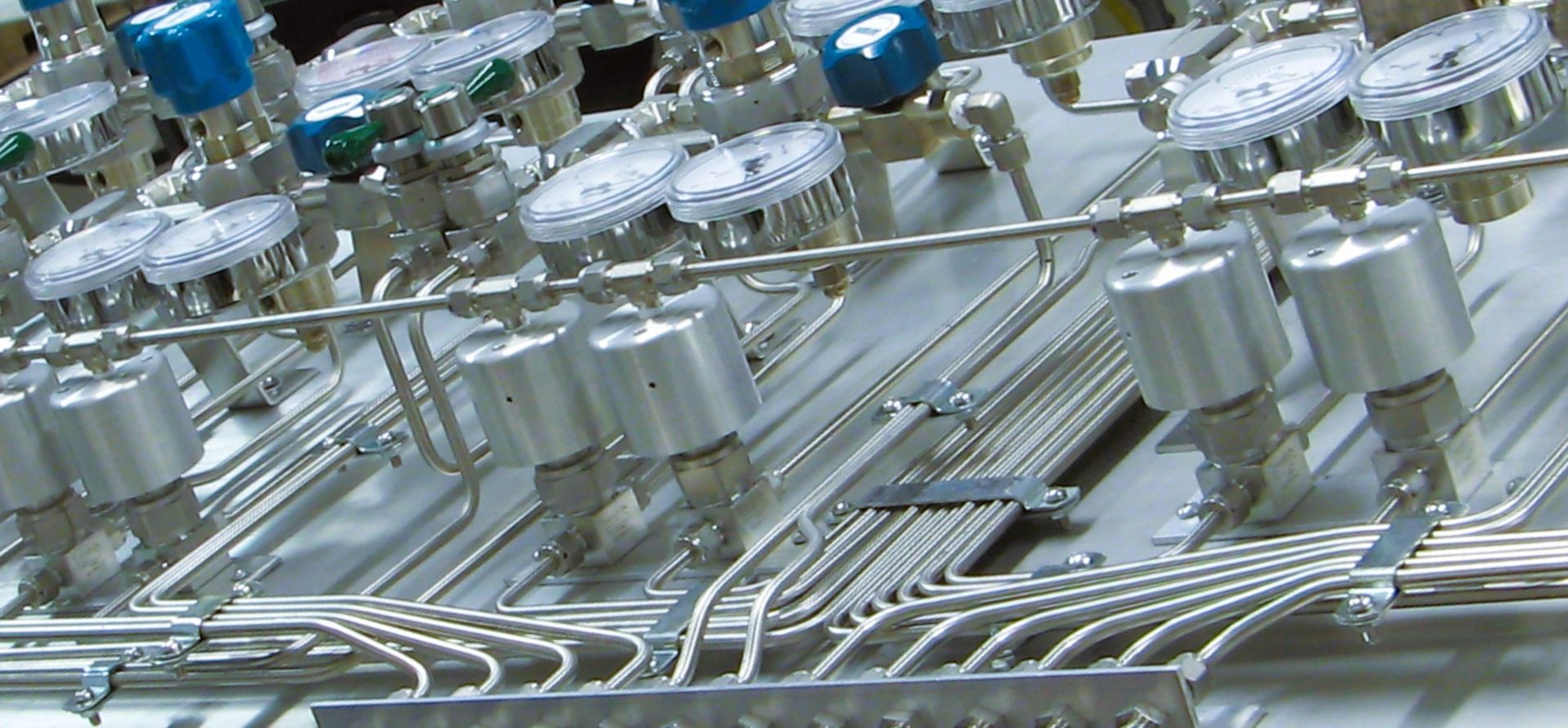 A bunch of metal pipes and valves on a table