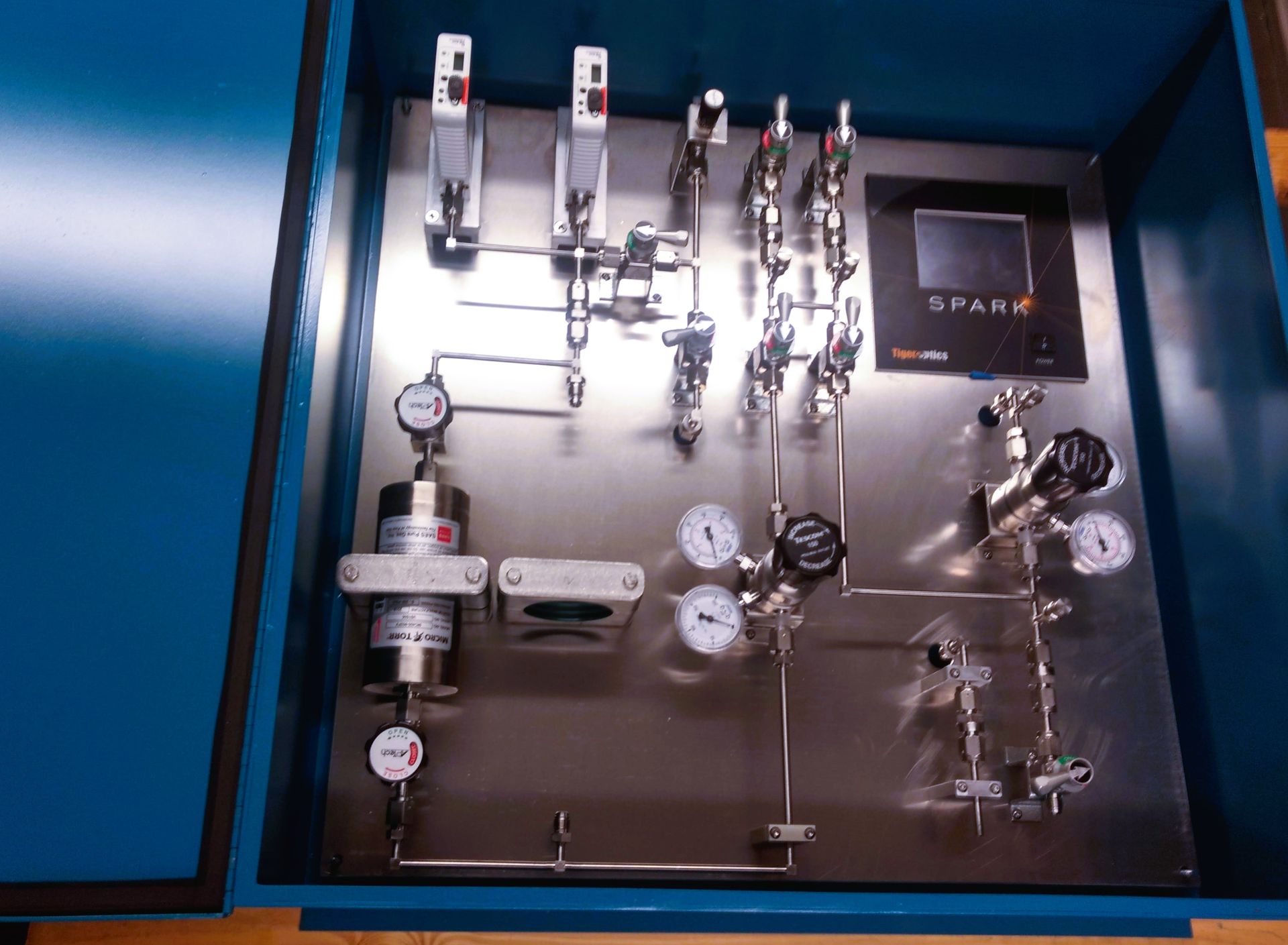 A stainless steel box with a display that says spark on it