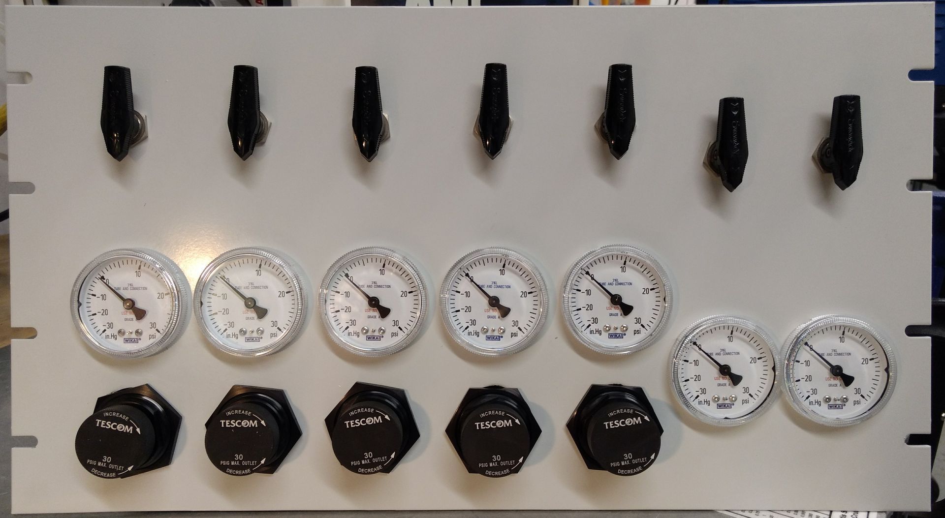 A white board with a bunch of gauges on it