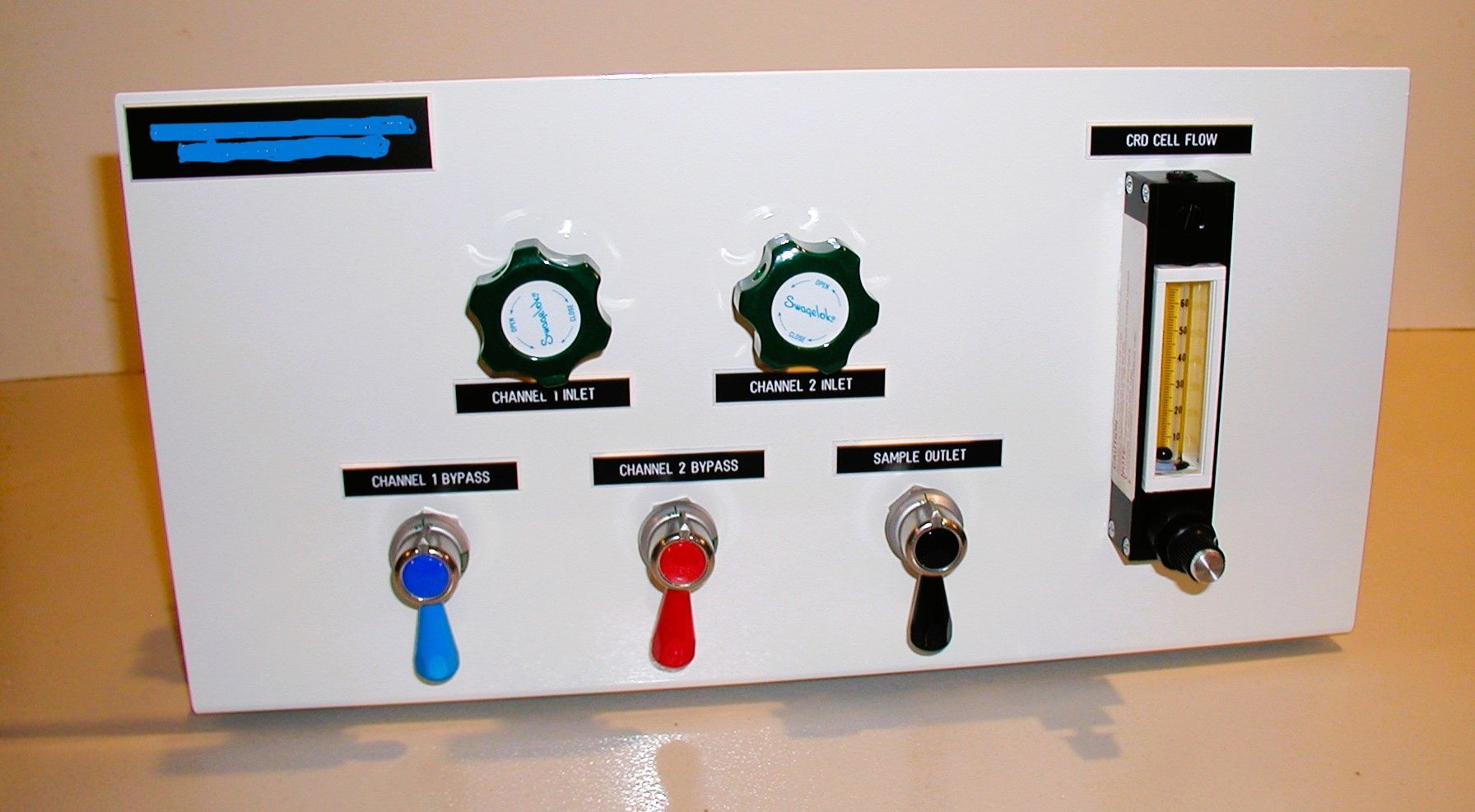 A white board with buttons and gauges on it