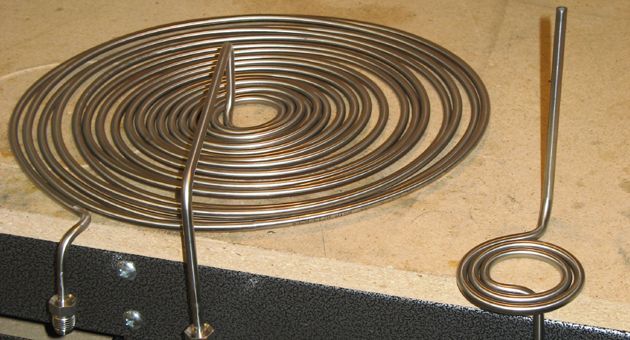 A stainless steel spiral is sitting on a table