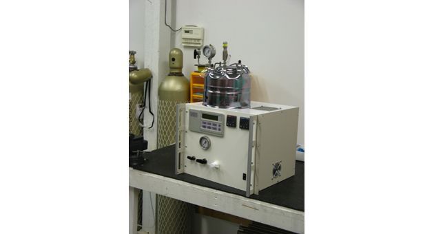 A machine is sitting on top of a table in a room.