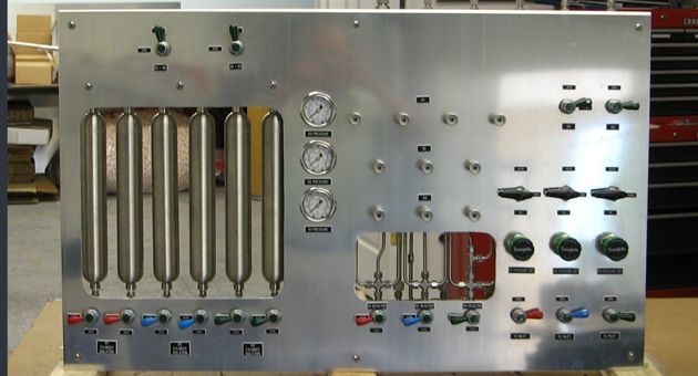 A stainless steel panel with a lot of numbers on it