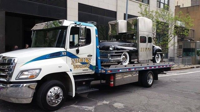 Nick’s Towing in Wallington NJ transporting vintage Zippo truck with professional flatbed towing service.