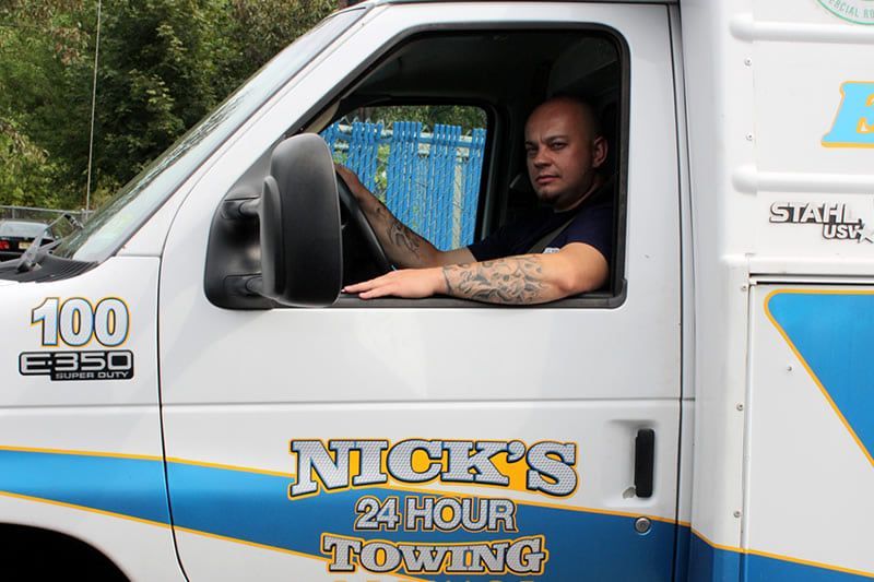 Nick’s Towing roadside tech in Wallington NJ ready for 24/7 mobile truck service and emergency towing.