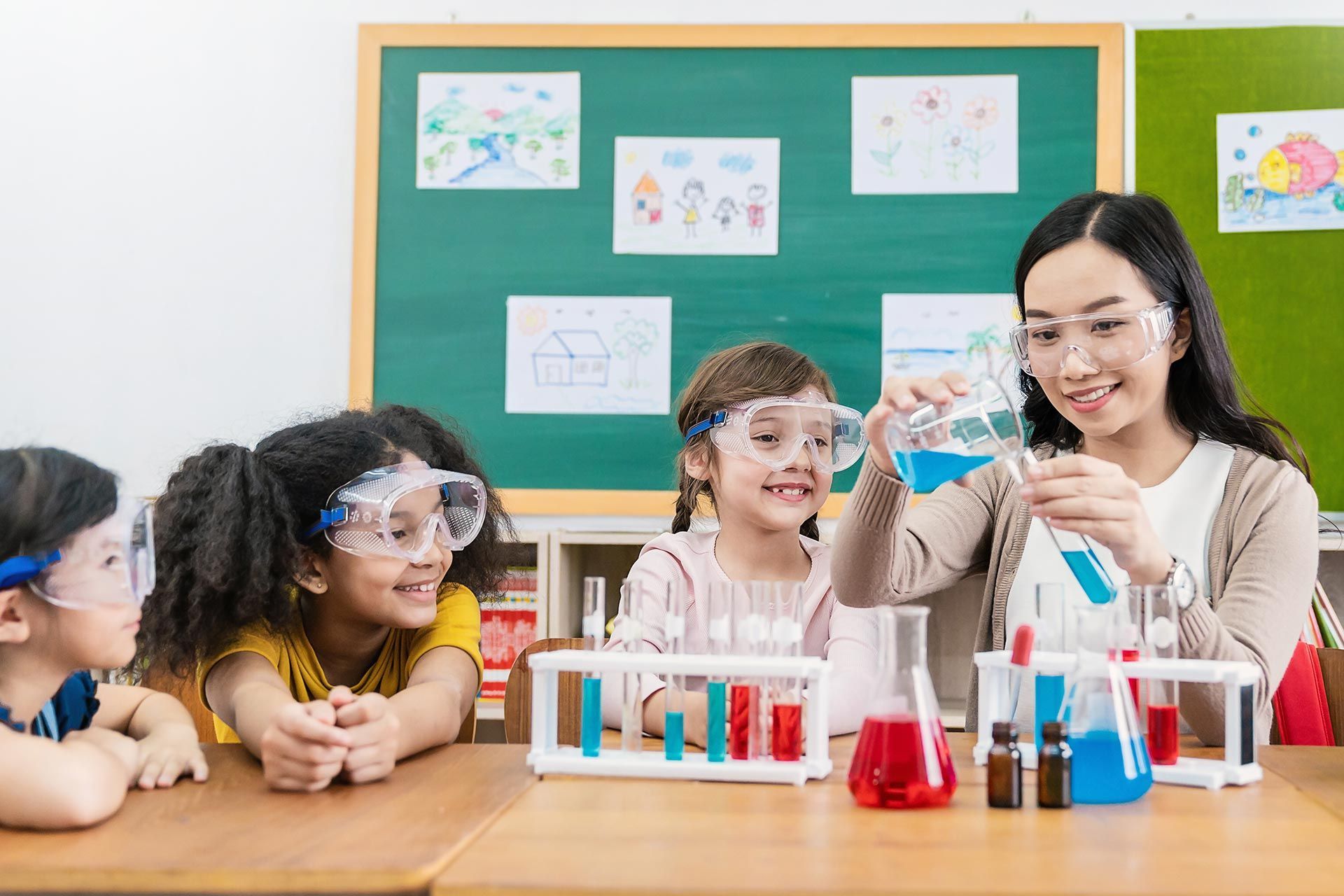 A teacher is teaching science to a group of kids.